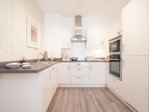 a kitchen with white cabinets