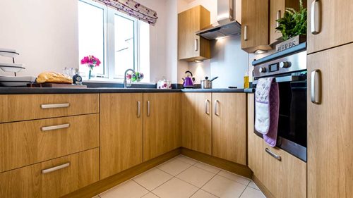 a kitchen with wooden cabinets