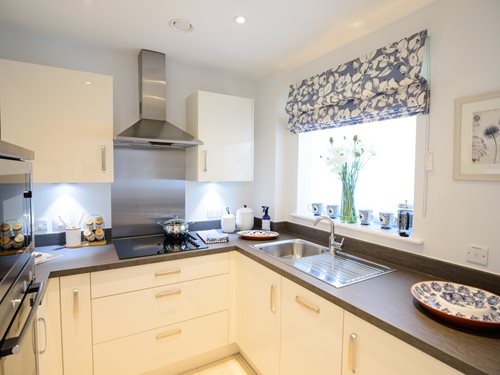 a kitchen with a sink and a stove