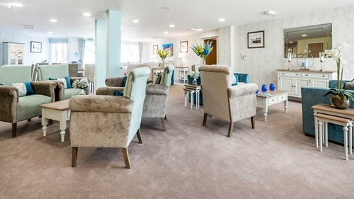 a large living room with a kitchen and dining room