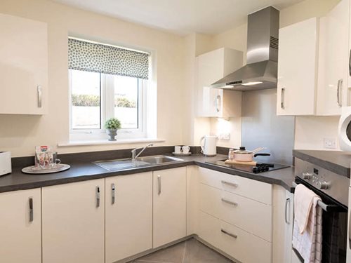 a kitchen with white cabinets