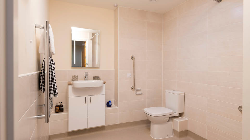 a bathroom with a sink toilet and a mirror