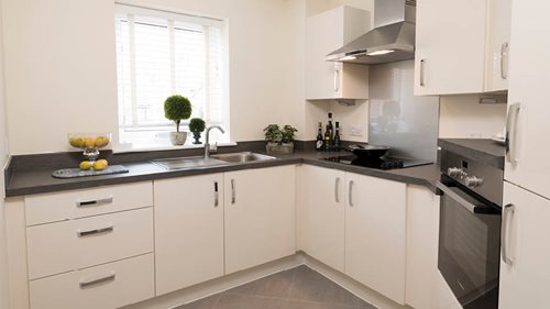 a kitchen with white cabinets
