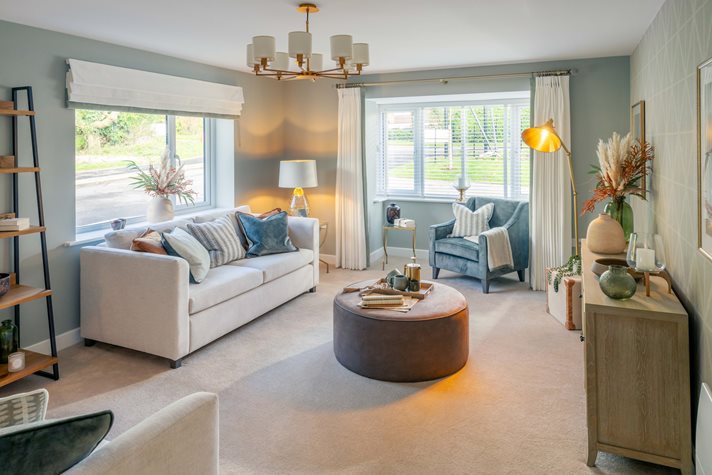 a living room with a white couch and a round table
