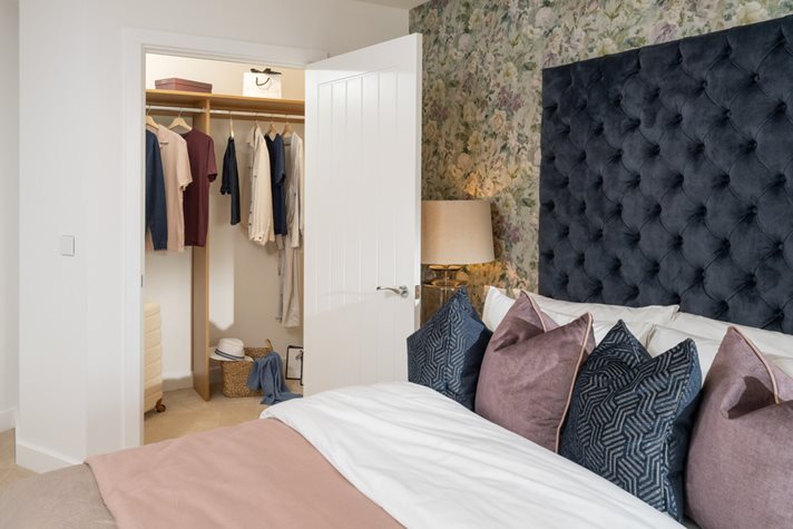 a bedroom with a bed and a closet