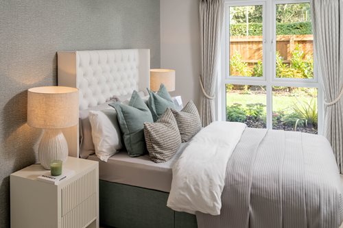 a bed with a white bed spread