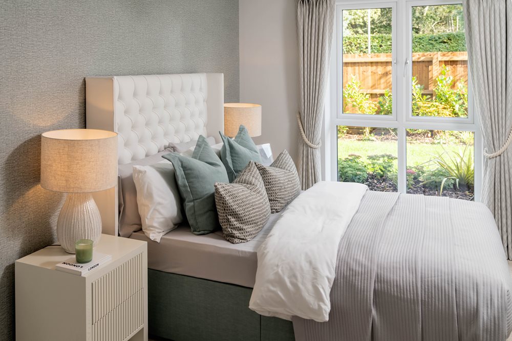 a bed with a white bed spread