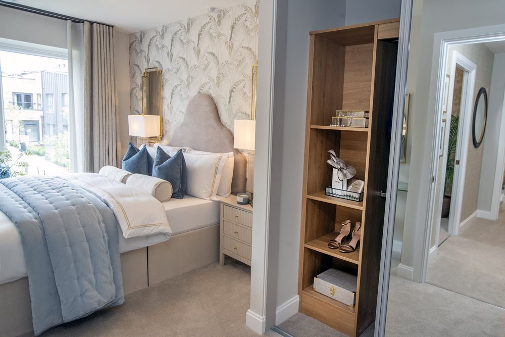 a bedroom with a bed and a shelf