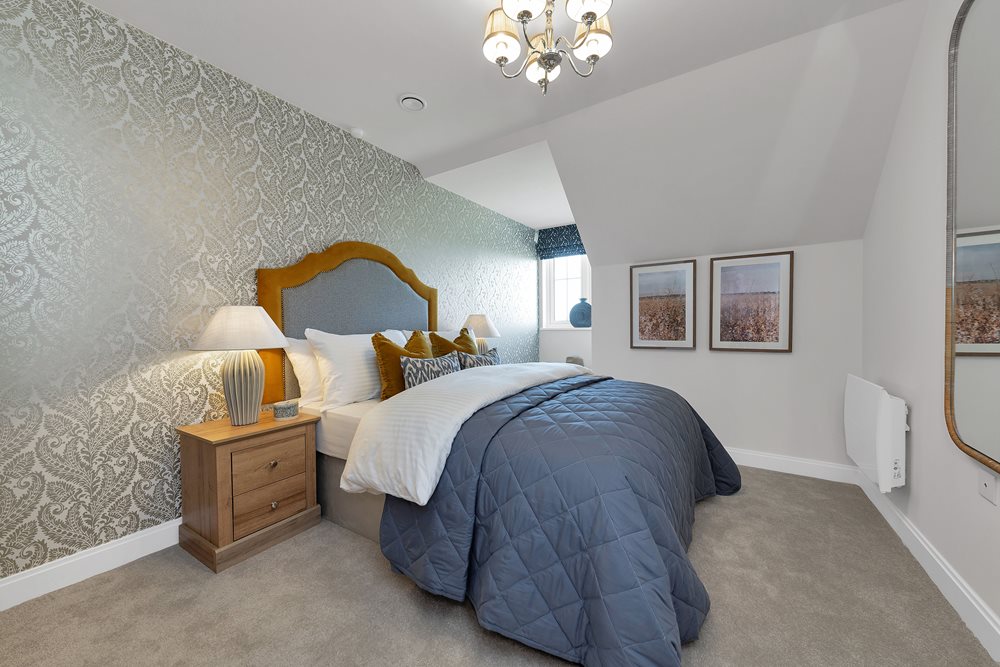 a bedroom with a bed and a mirror