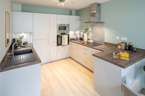 a kitchen with a wood floor
