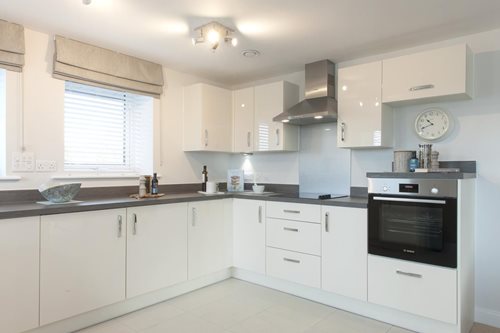 a kitchen with white cabinets