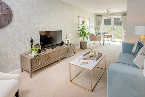 a living room with a tv and couches