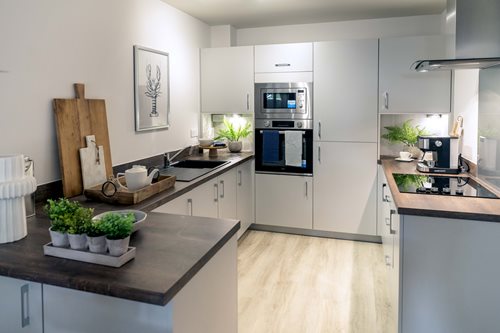 a kitchen with a wood floor