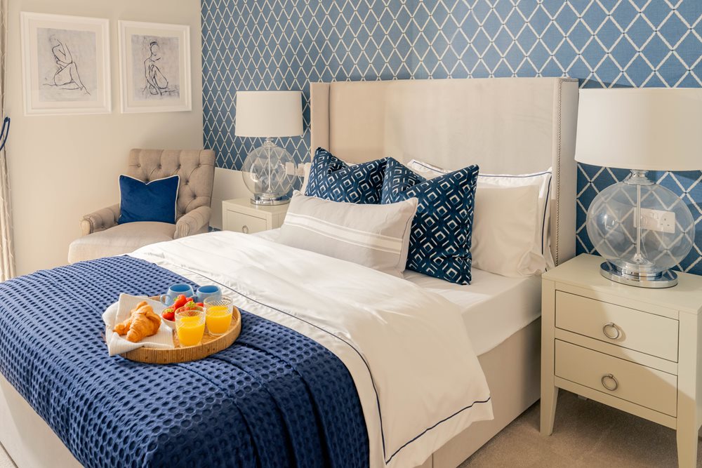 a couple of beds in a room