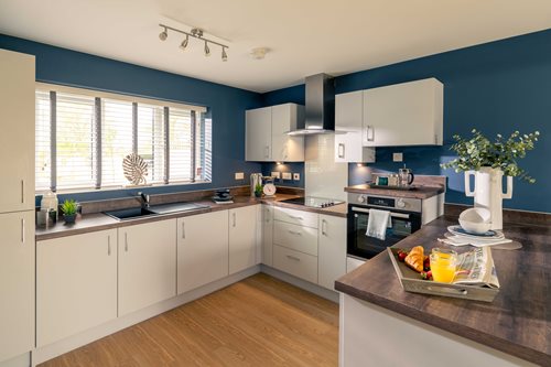 a kitchen with white cabinets