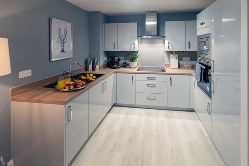 a kitchen with white cabinets