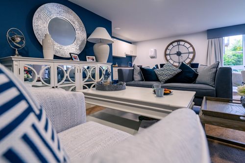 a living room with couch and table