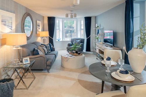 a living room with a tv and couches