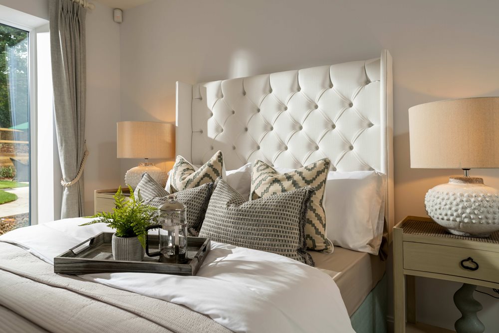 a bed with a white bed spread