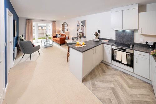 a kitchen with white cabinets