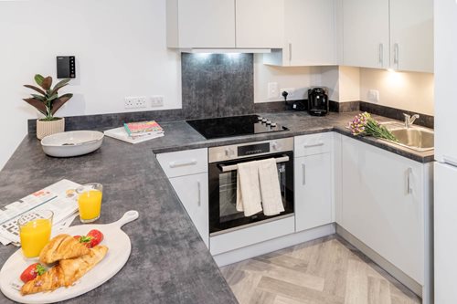 a kitchen with white cabinets