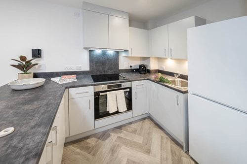 a kitchen with white cabinets