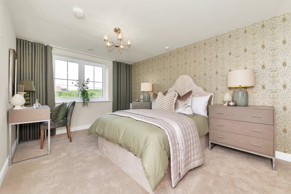 a bedroom with a bed and lamps