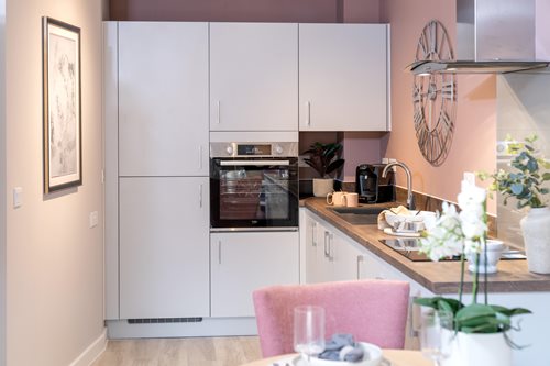a kitchen with white cabinets