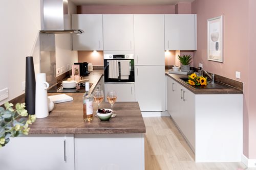 a kitchen with a marble counter top