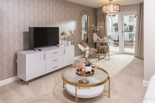 a living room with a tv and a table