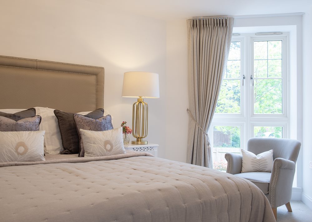 Bedroom with lamp and chair