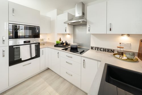a kitchen with white cabinets