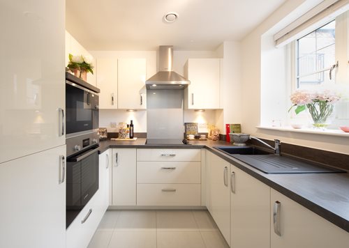 Kitchen with white cupboards