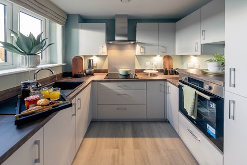 a kitchen with white cabinets