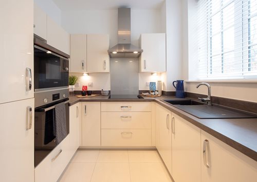a kitchen with white cabinets