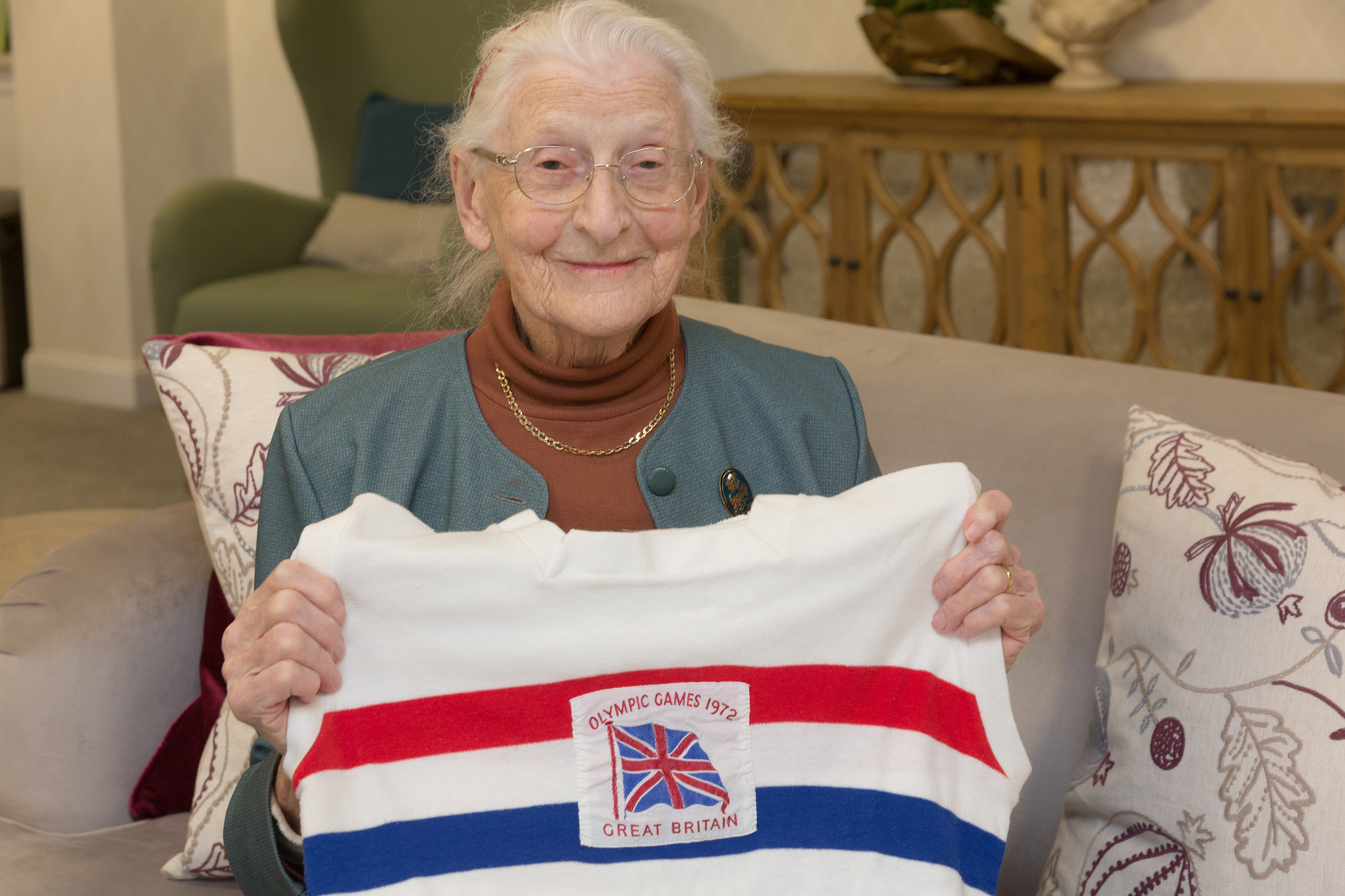 an old woman holding a flag