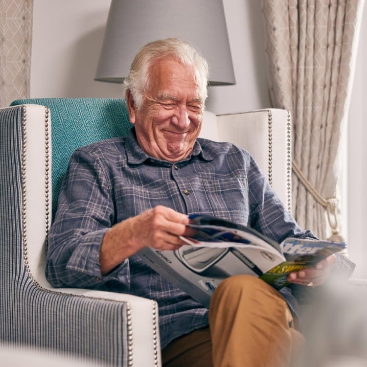 an old man sitting in a chair