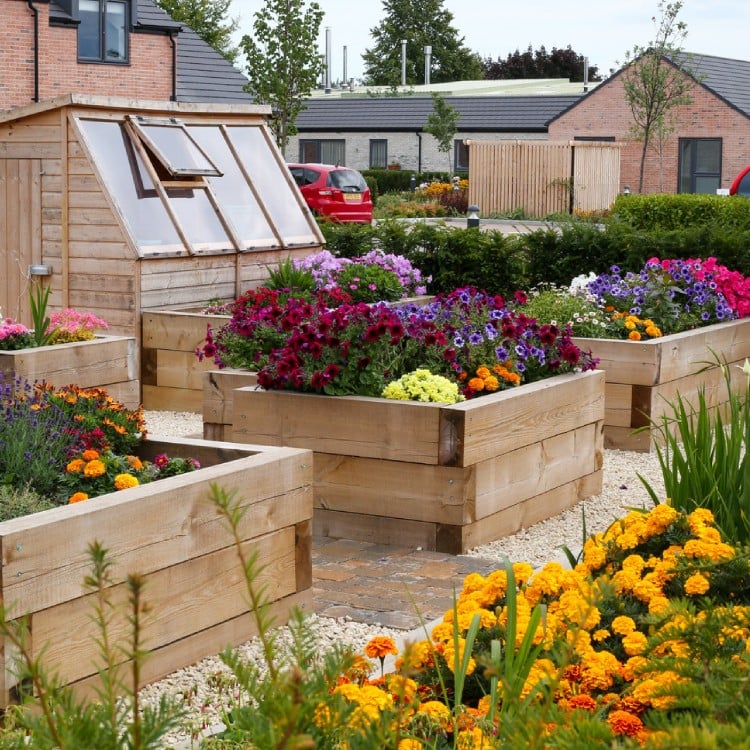 a landscape garden with flowers at a retirement development