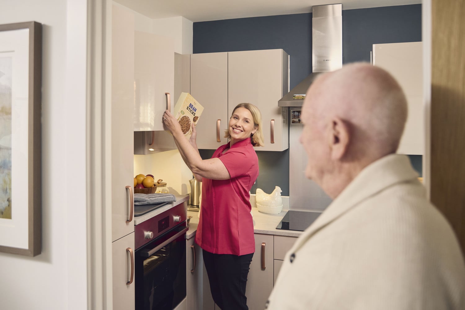 a woman standing in a kitchen