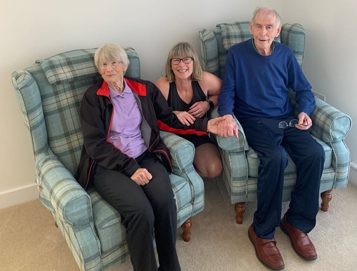 a group of people sitting on a couch