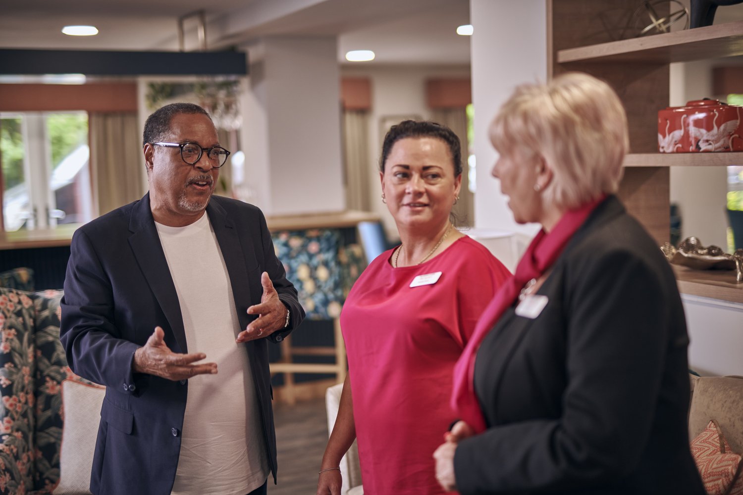 A House Manager and staff member in conversation with a homeowner at a McCarthy Stone development