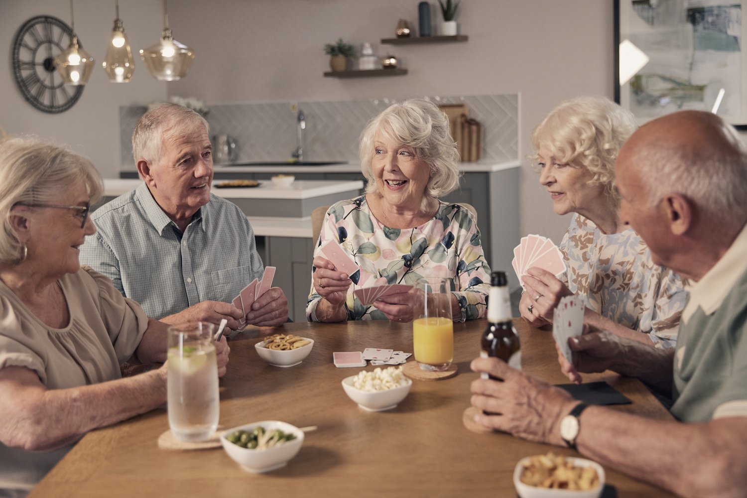 Older people playing games at their McCarthy Stone retirement living community for the over 70s