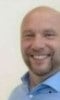 a man smiling for the camera