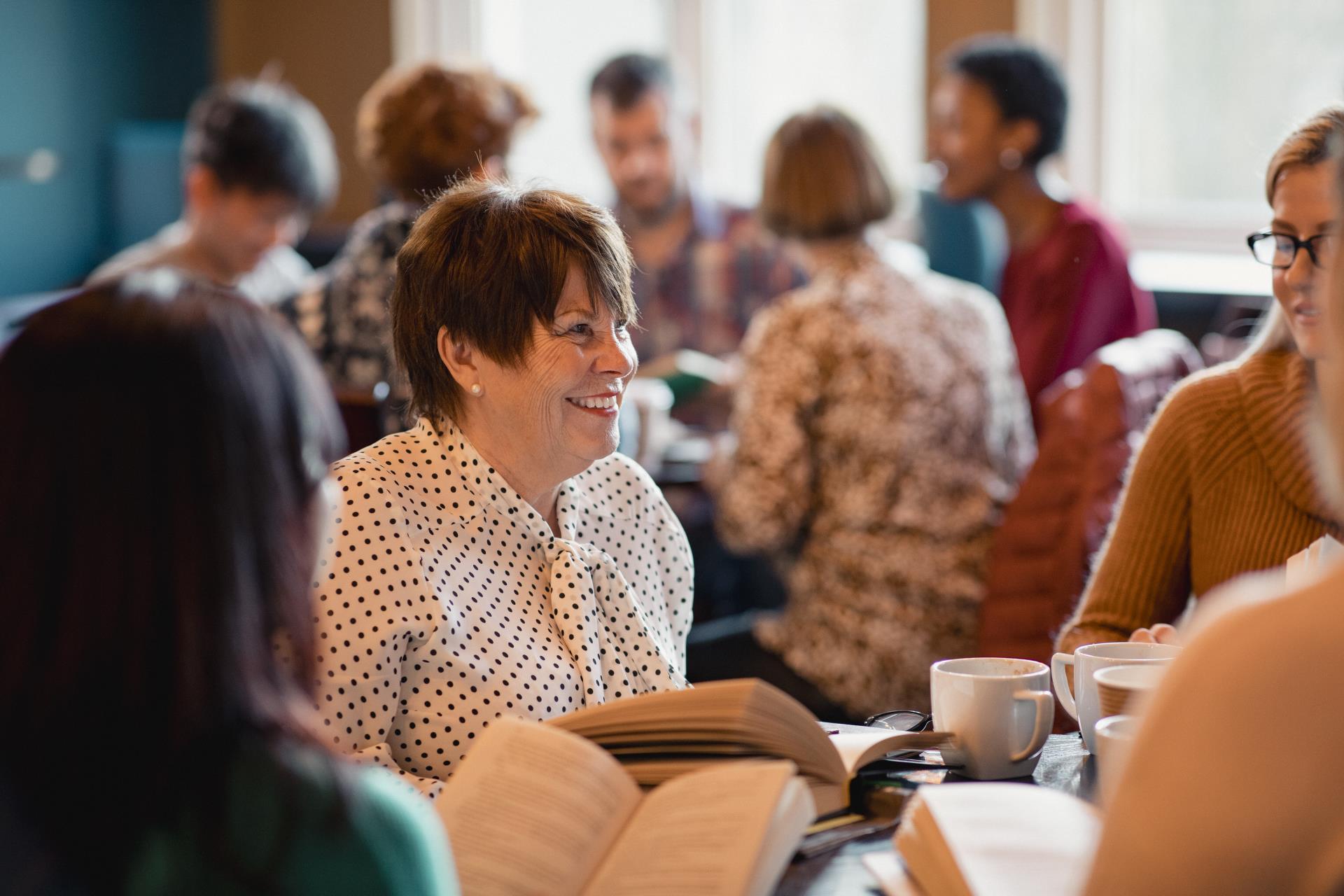 a group of people sitting at tables