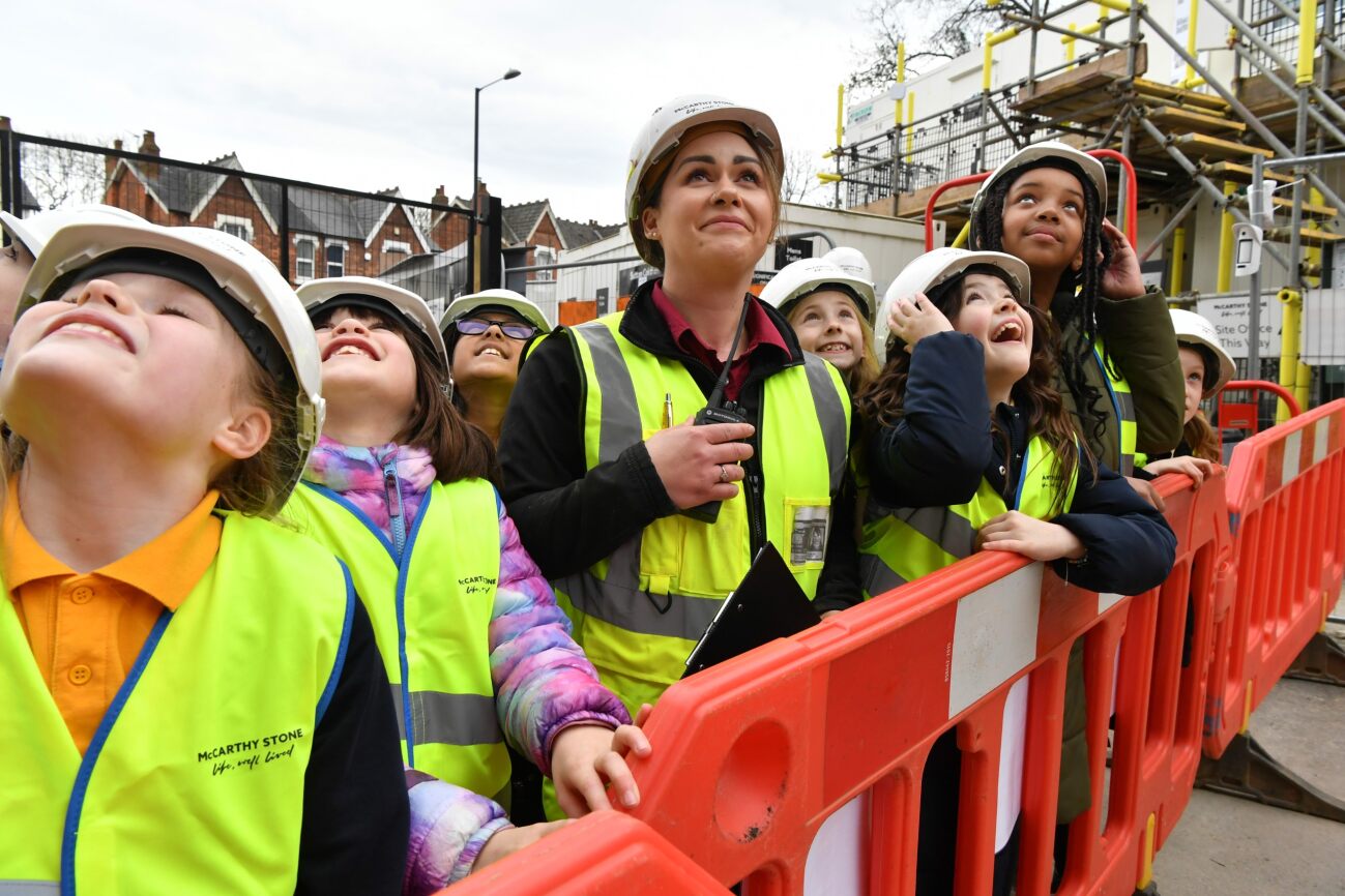 a group of people wearing safety vests