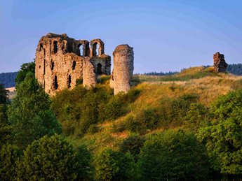 a stone castle on a hill