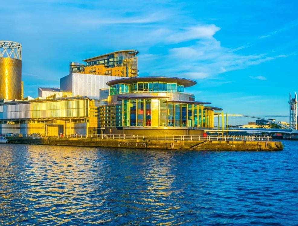 a building with a body of water in front of it