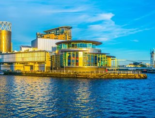 a building with a body of water in front of it